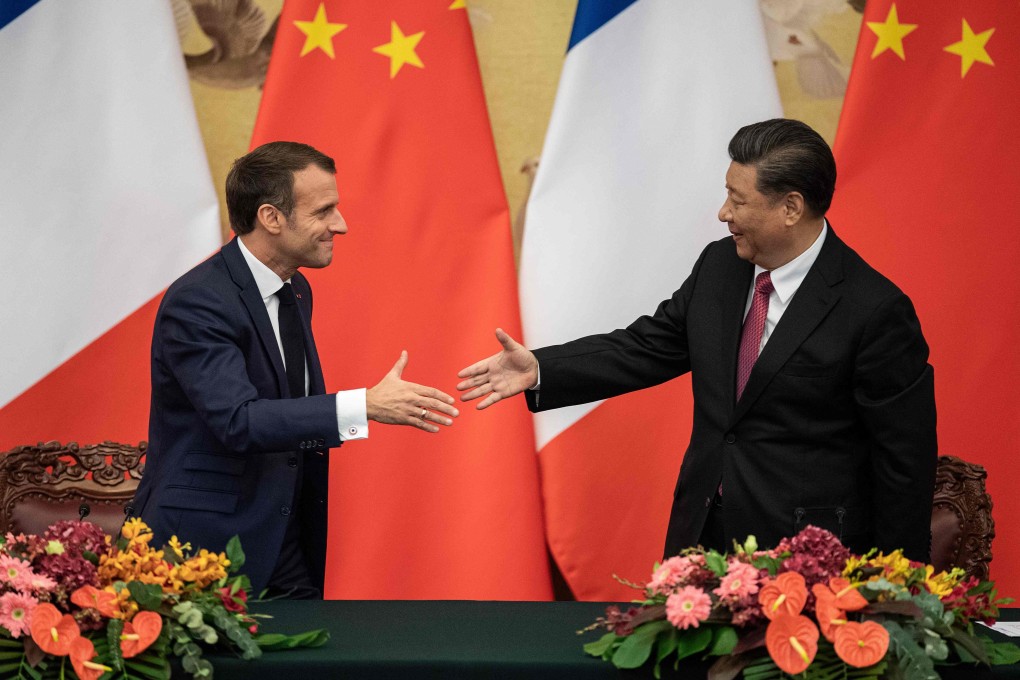 French President Emmanuel Macron shakes hands with Chinese President Xi Jinping after a signing ceremony at the Great Hall of the People in Beijing. Photo: AP