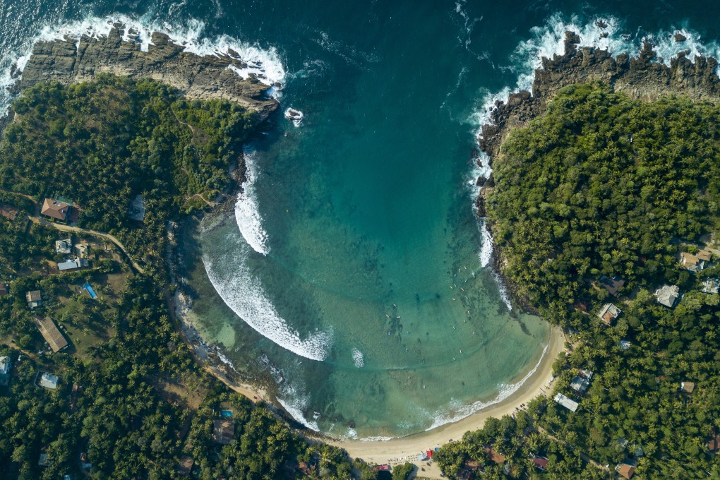 An aerial view of Hiriketiya bay in Sri Lanka’s south coast. It’s a tranquil location that’s loved by surfers. Photo: David Burden
