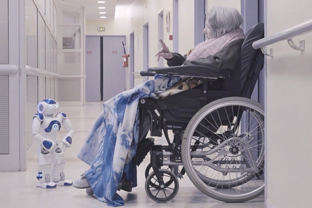 “The Age of Robots” exhibition in Hong Kong shows how interaction with a robot can brighten the day for some patients in hospitals and nursing homes. This still from a video clip shows a woman and a robot having an intimate dialogue about birds and a dream of learning to fly. Photo: Yves Gellie