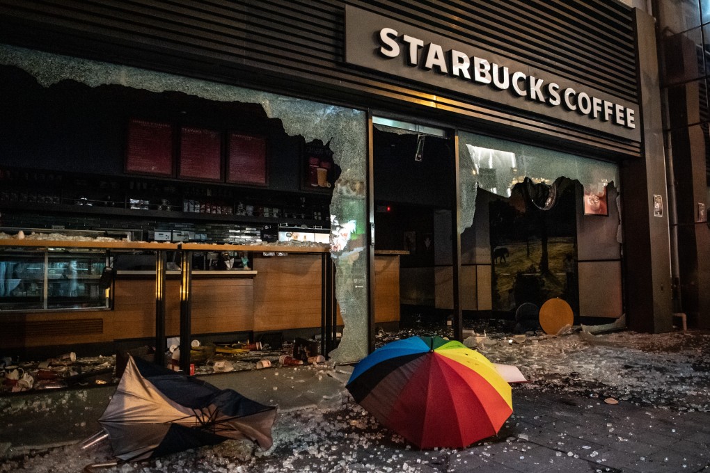 An umbrella and debris lie outside a vandalised Starbucks cafe in Sheung Wan district in Hong Kong. Photo: Bloomberg