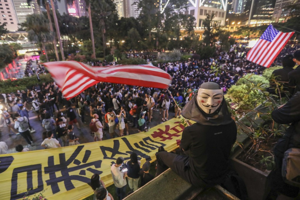 Anti-government protesters wave American flags during their rally at Chater Garden in Central on October 26. Photo: Xiaomei Chen