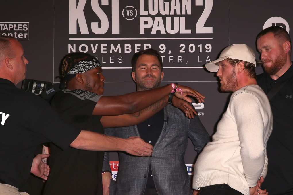 YouTube stars KSI (left) and Logan Paul face off onstage while promoter Eddie Hearn looks on at their final press conference in Los Angeles. Photo: AFP