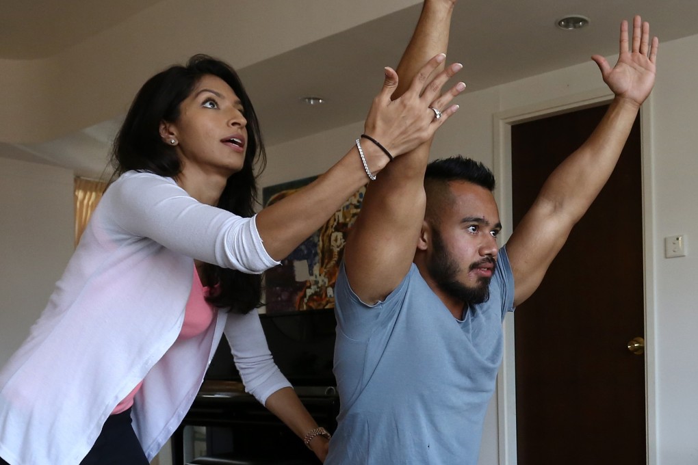 Neelam Harjani, a trader at a bank before she quit to set up Inspire Yoga, says she found yoga was an antidote to stress at work. She now leads classes to help those looking for calm and relief from busy lifestyles. Photo: Jonathan Wong