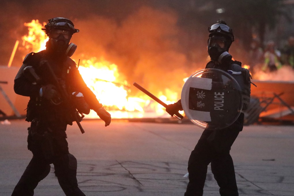 Anti-riot and Special Tactical Squad officers of Hong Kong police in action during violent demonstrations in Mong Kok on October 20, the 20th consecutive weekend of anti-government protests. Photo: K.Y. Cheng