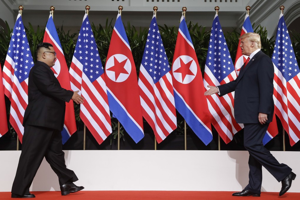 North Korean leader Kim Jong-un and US President Donald Trump greet each other in Singapore in June 2018. Photo: AP