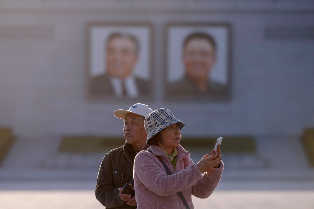 Chinese tourists in Kim Il-sung Square, in Pyongyang, North Korea, in April. Photo: AFP