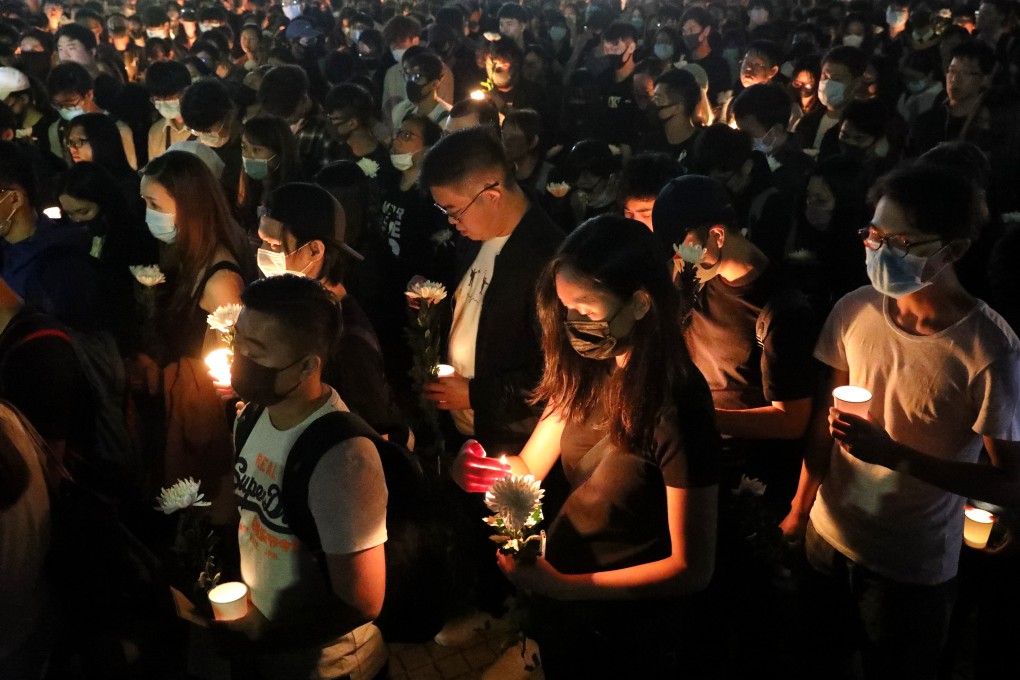 Students in black mourn the death of Chow Tsz-lok, who died from head injuries on Friday morning. Photo: Dickson Lee