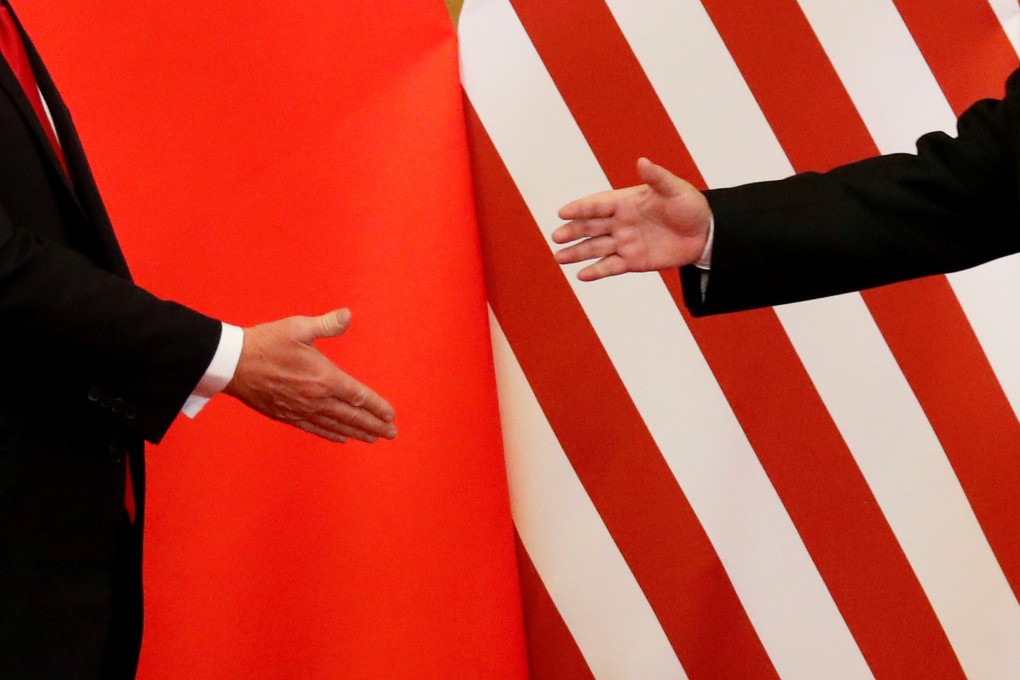 US President Donald Trump and Chinese President Xi Jinping shake hands at the Great Hall of the People in Beijing on November 9, 2017. Photo: Reuters