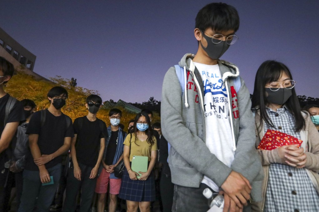 Students pray for Chow Tsz-Lok, who suffered a serious brain injury in a fall in a car park in Tseung Kwan O. Photo: Felix Wong