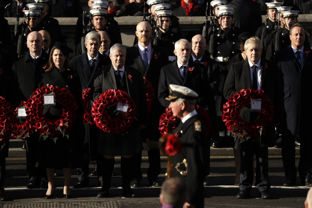 British political leaders watch as Prince Charles prepares to lay a wreath at the Remembrance Sunday ceremony at the Cenotaph in Whitehall, London. Photo: AP