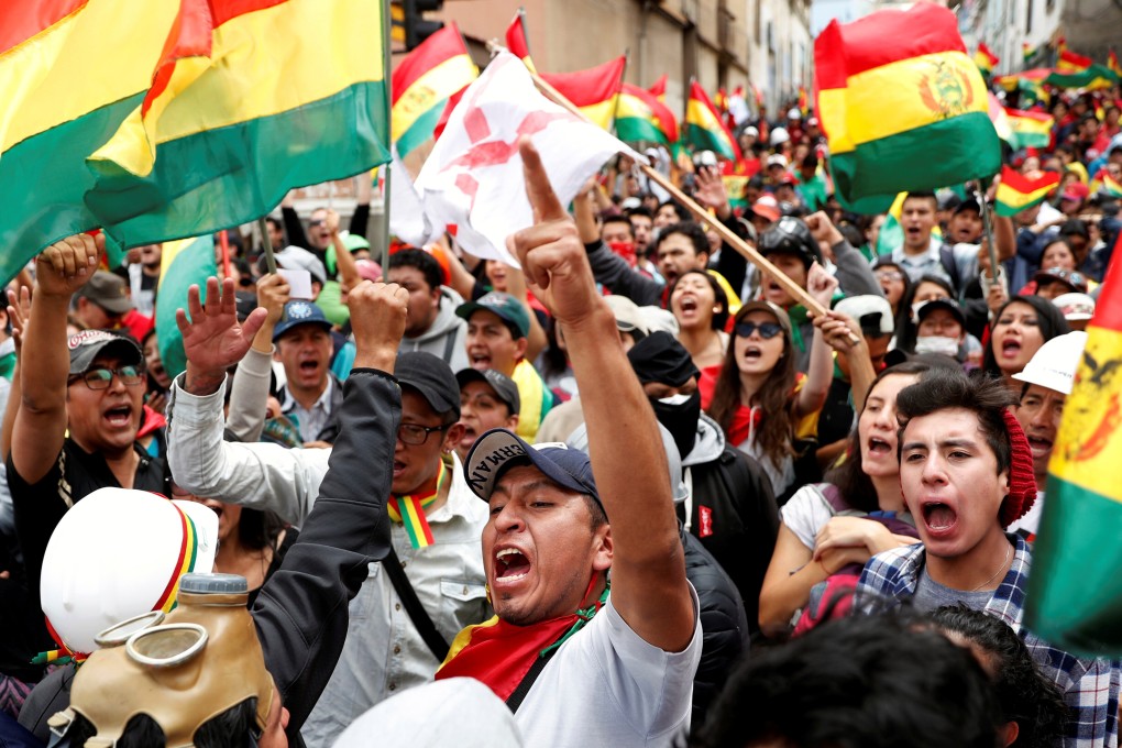 People shout slogans during a protest against Bolivia's President Evo Morales in La Paz. Photo: Reuters