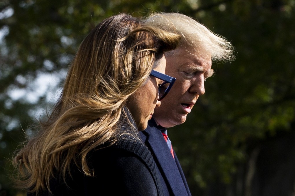 US President Donald Trump and First Lady Melania Trump walking across the South Lawn of the White House on their way to Alabama to watch a college-football game on Saturday. Photo: EPA-EFE