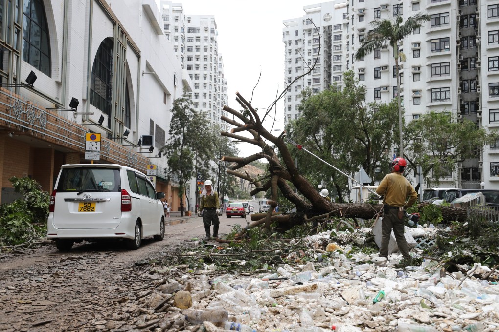 Workers clear debris in Heng Fa Chuen following Typhoon Mangkhut. Photo: Winson Wong