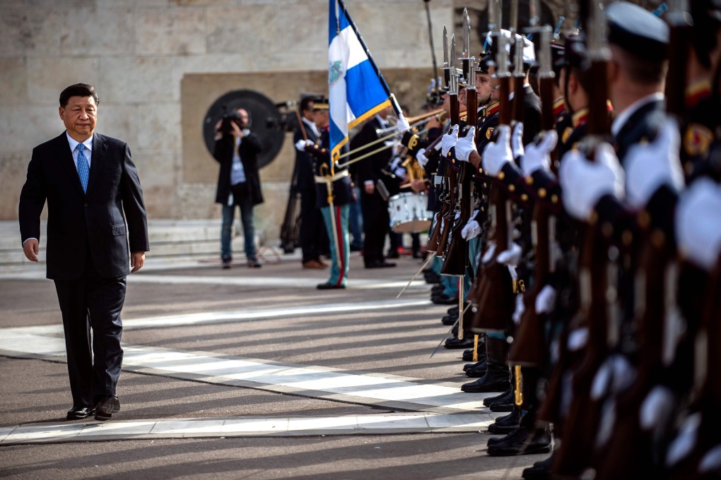 Chinese President Xi Jinping reviews a guard of honour during a wreath-laying ceremony at the monument of the unknown soldier in Athens. Photo: AFP