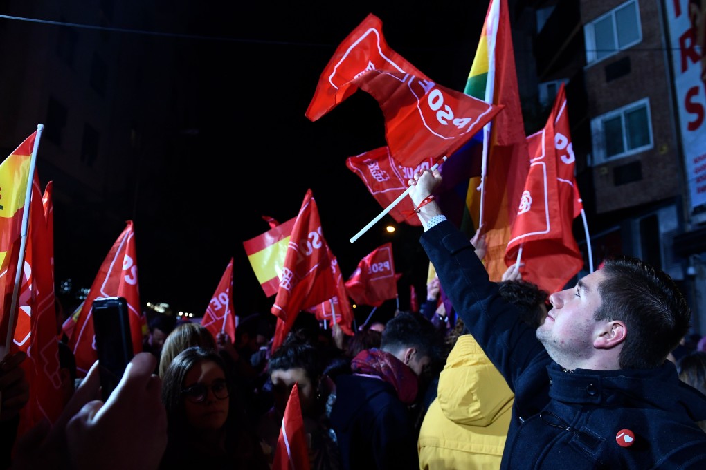 Spanish Socialist Party (PSOE) supporters celebrate their victory in the general elections in Madrid on November 10. Photo: AFP