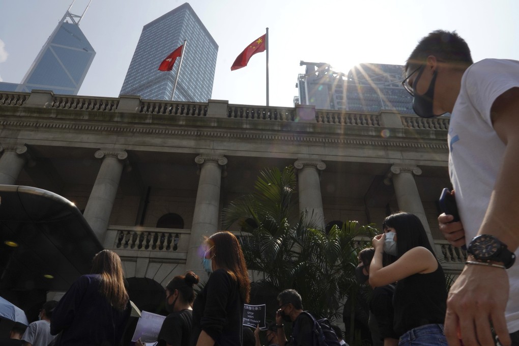 Protesters march past the Court of Final Appeal in Hong Kong on October 11. Photo: AP