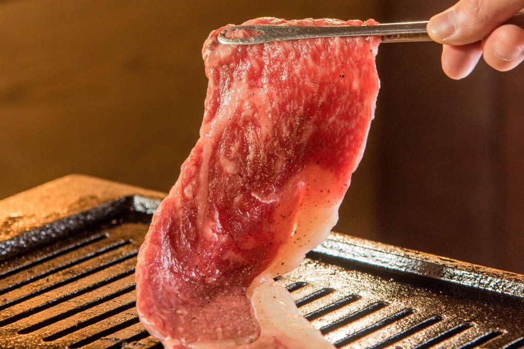 At YakiniKuu, each table is equipped with an elevated grill and a descending exhaust fan that catches the fumes.