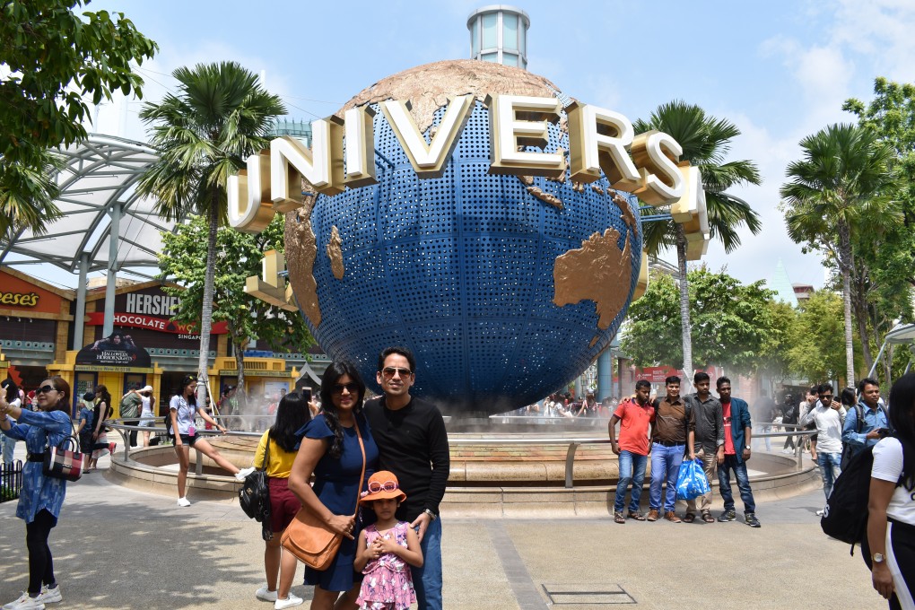 An Indian family pose at Universal Studios Singapore. Photo: Shutterstock