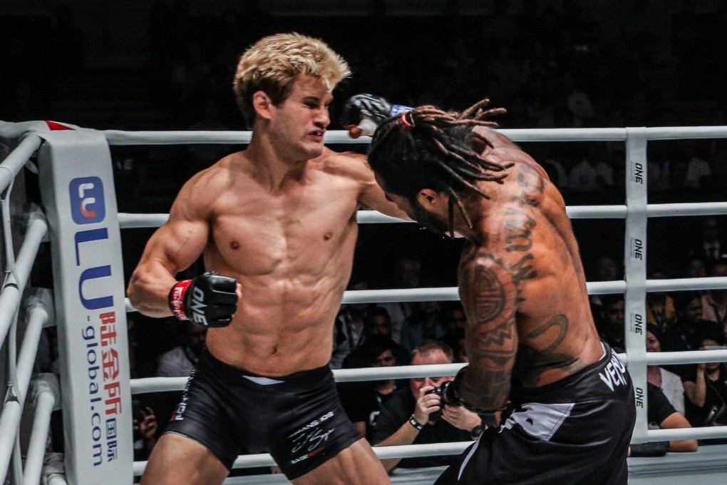 Cosmo Alexandre unleashes an overhand right against Sage Northcutt. Photo: One Championship