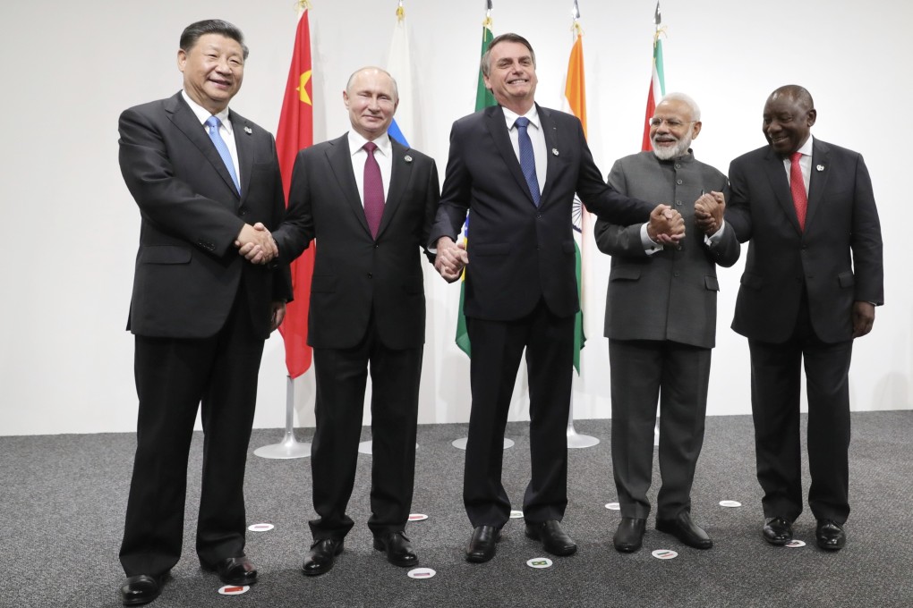 Chinese President Xi Jinping, Russian President Vladimir Putin, Brazilian President Jair Bolsonaro, Indian Prime Minister Narendra Modi and South African President Cyril Ramaphosa pose for a photo prior to a BRICS meeting on the sidelines of the G20 summit in Osaka on June 28. Photo: AP