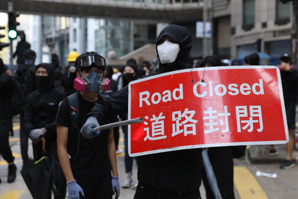 Protesters blocked roads, forcing the suspension of scores of bus routes in Hong Kong. Photo: EPA