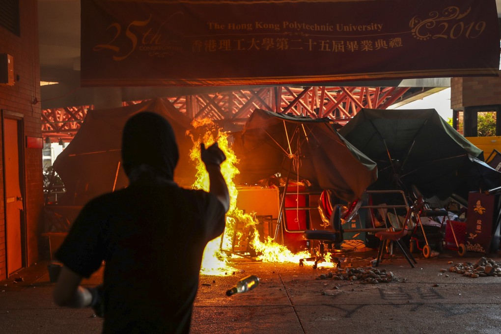 Protesters set fires and vandalise facilities at the Polytechnic University in Hung Hom in the early hours of November 11. Photo: Sam Tsang