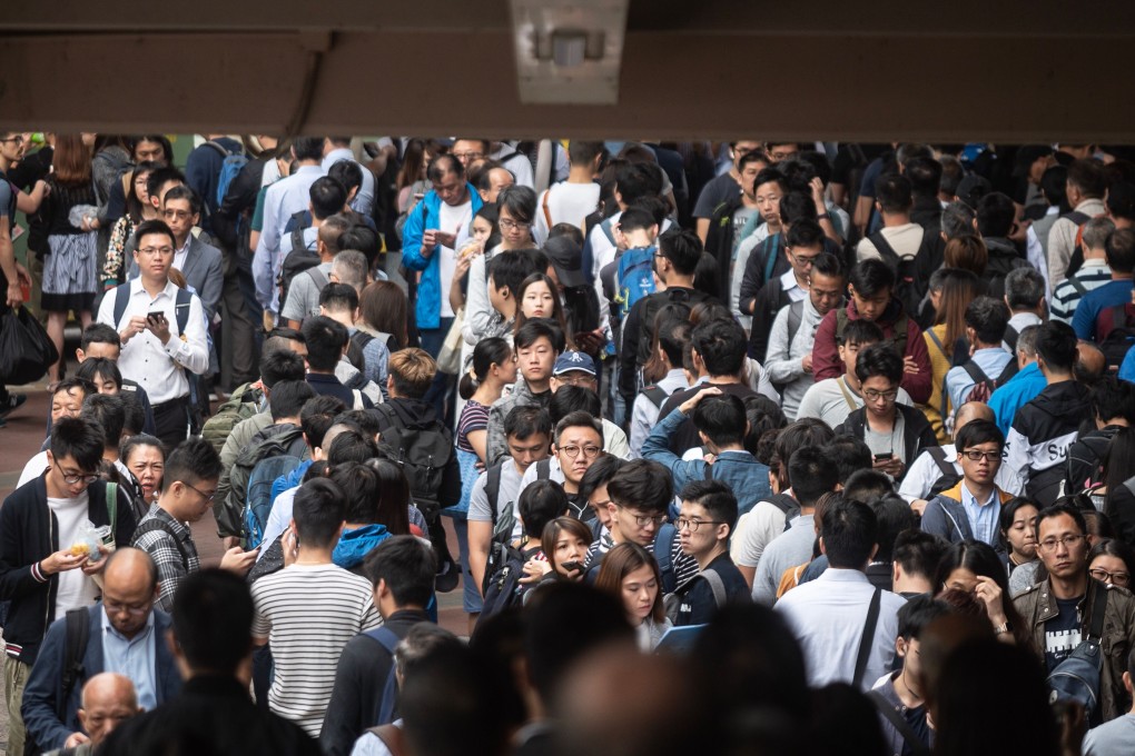 Rush-hour commuters queue for other forms of public transport at Sha Tin MTR station, as protesters disrupted train services on November 12. Photo: AFP