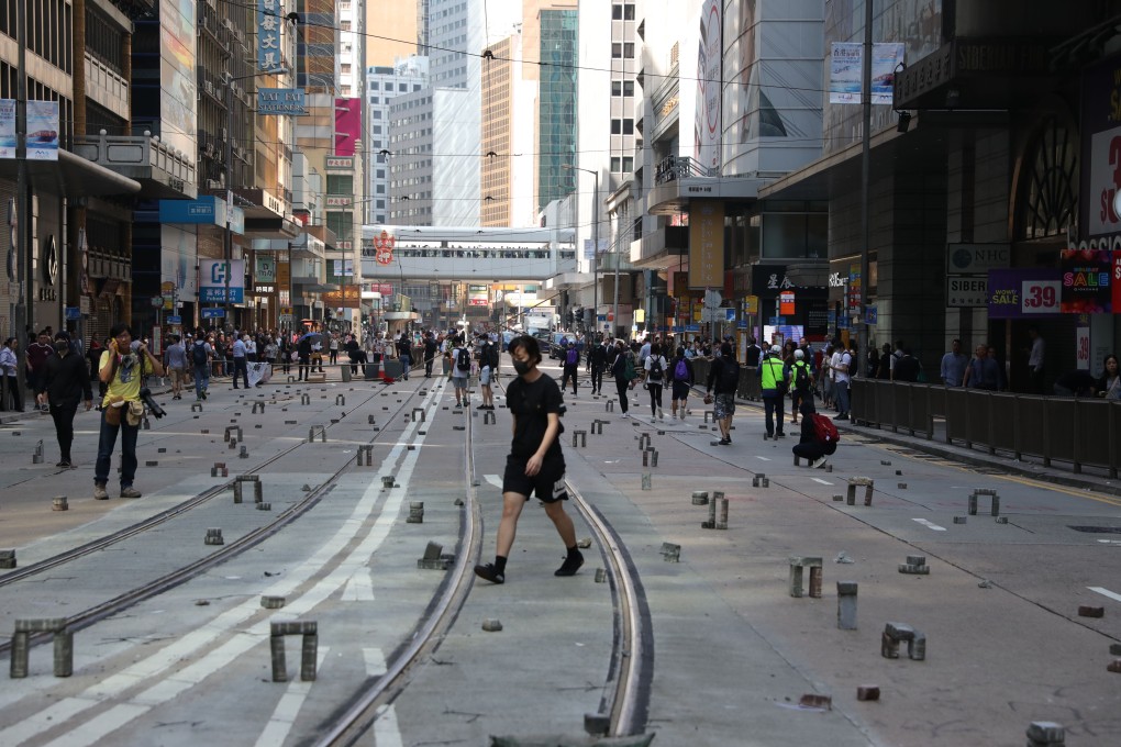 Bricks are spread on a road in Central on Wednesday, deterring taxis and other vehicles on what is normally a busy street. Photo: May Tse