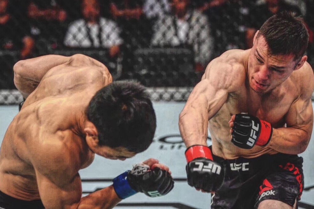 Heili Alateng (right) from China’s Inner Mongolia autonomous region lands a punch on Batgerel Danaa of Mongolia during their UFC bantamweight bout in Shenzhen in August. Alateng won by unanimous decision.
