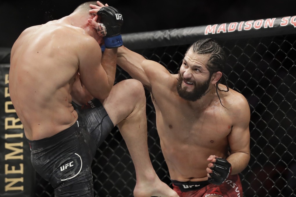 Jorge Masvidal punches Nate Diaz during the second round at UFC 244. Photo: AP