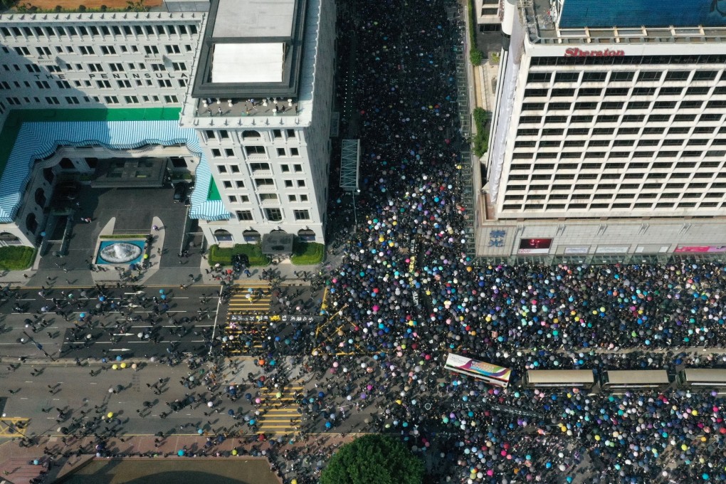 Aerial drone view of buses trapped amongst anti-government protesters in Tsim Sha Tsui, between The Peninsula hotel (left) and Sheraton Kowloon (right) on 20 October 2019. Photo: May Tse