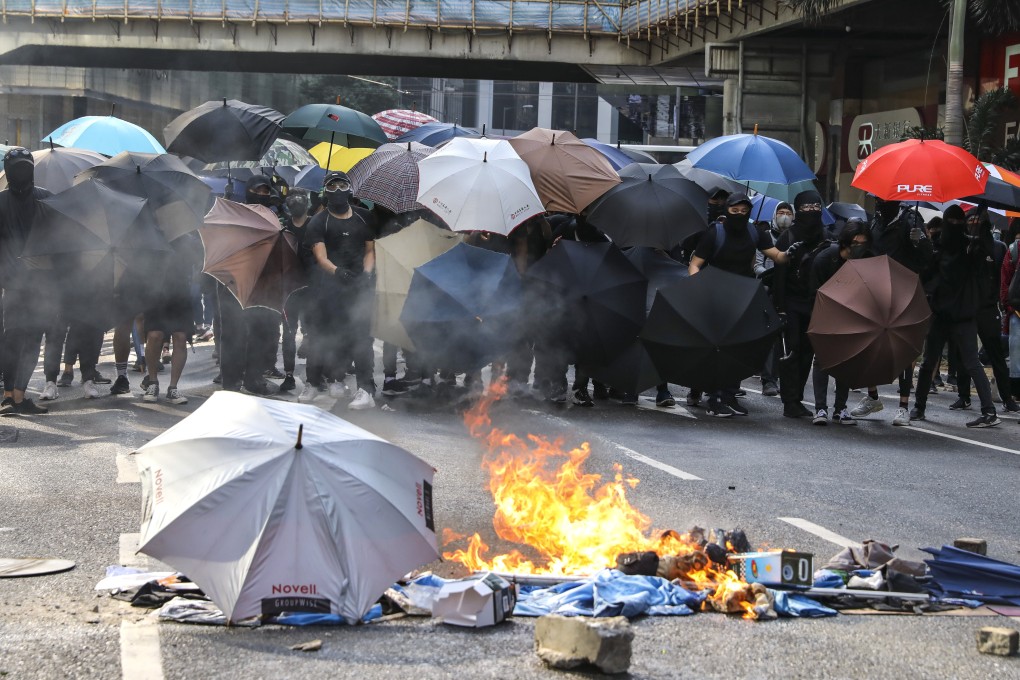 Police fire tear gas as anti-government protesters hold a lunchtime rally on Tuesday in Central. Photo: K.Y. Cheng