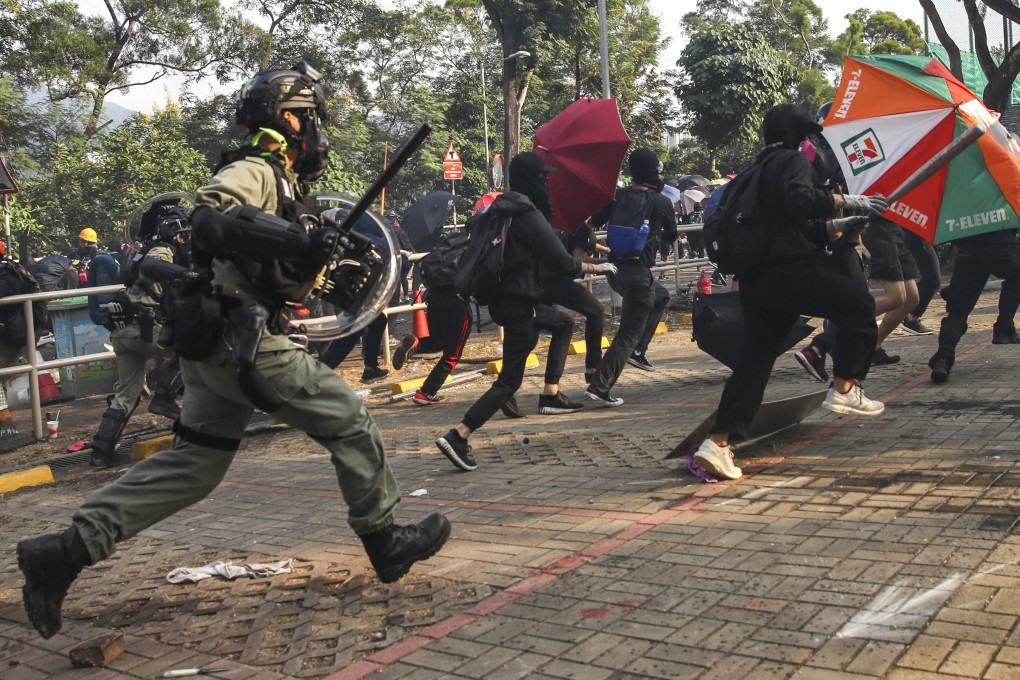 Police chase protesters at Chinese University in Sha Tin. Photo: Winson Wong