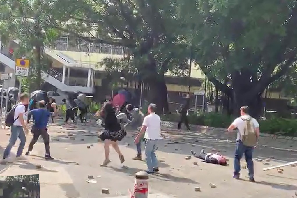 The 70-year-old man was among more than 20 local residents who were clearing bricks left by protesters outside Sheung Shui MTR station. Photo: Frame Grab