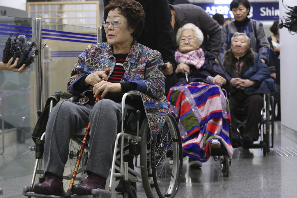 Former South Korean sex slaves Lee Yong-soo, Lee Ok-seon and Gil Won-ok leave the Seoul Central District Court after a hearing in the long-awaited civil case filed against the Japanese government. Photo: AP