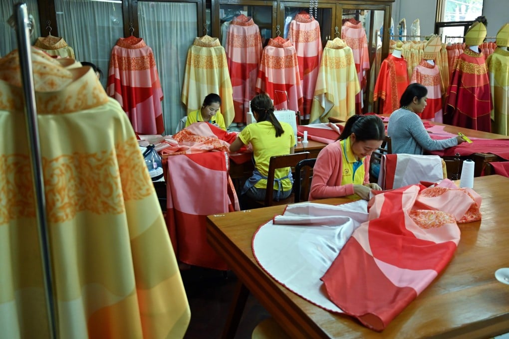 Thai seamstresses work on religious vestments at the Praharuthai Convent in Bangkok ahead of the visit of Pope Francis and his entourage to Thailand. Photo: AFP/Romeo Gacad