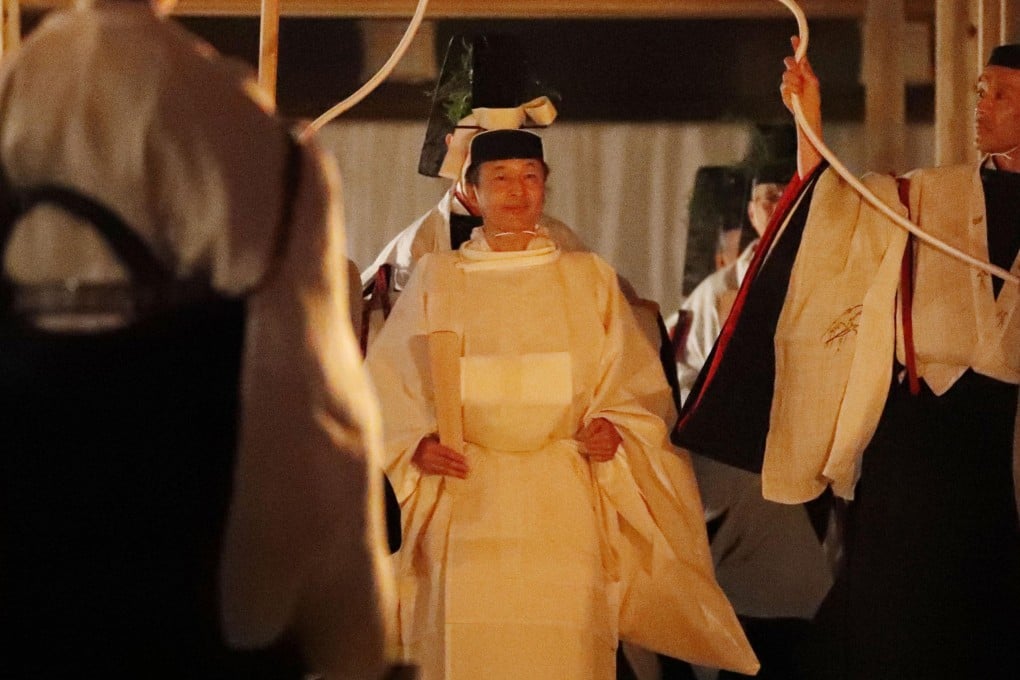Japan's Emperor Naruhito, centre, walks toward Yukiden, one of two main halls of the shrine for Daijosai at the Imperial Palace in Tokyo. Photo: Kyodo