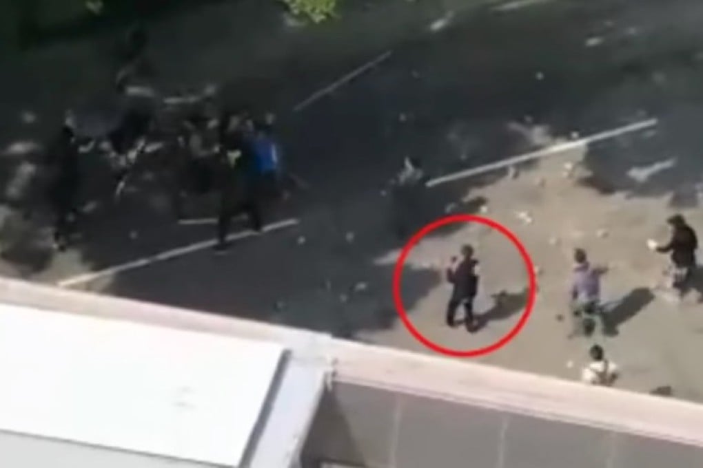 The 70-year-old man (circled) had been taking pictures when hit on the head by a brick, police say. Photo: Facebook