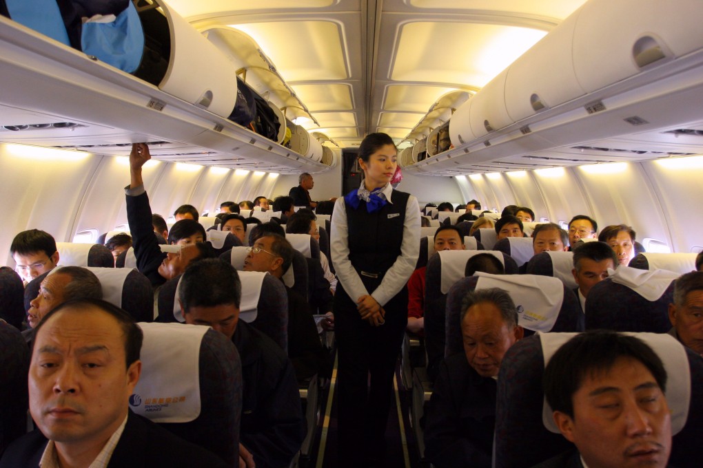 One woman’s plane ride was made worse by a fellow passenger’s decision to prop his or her feet up on her headrest. Photo: Alamy