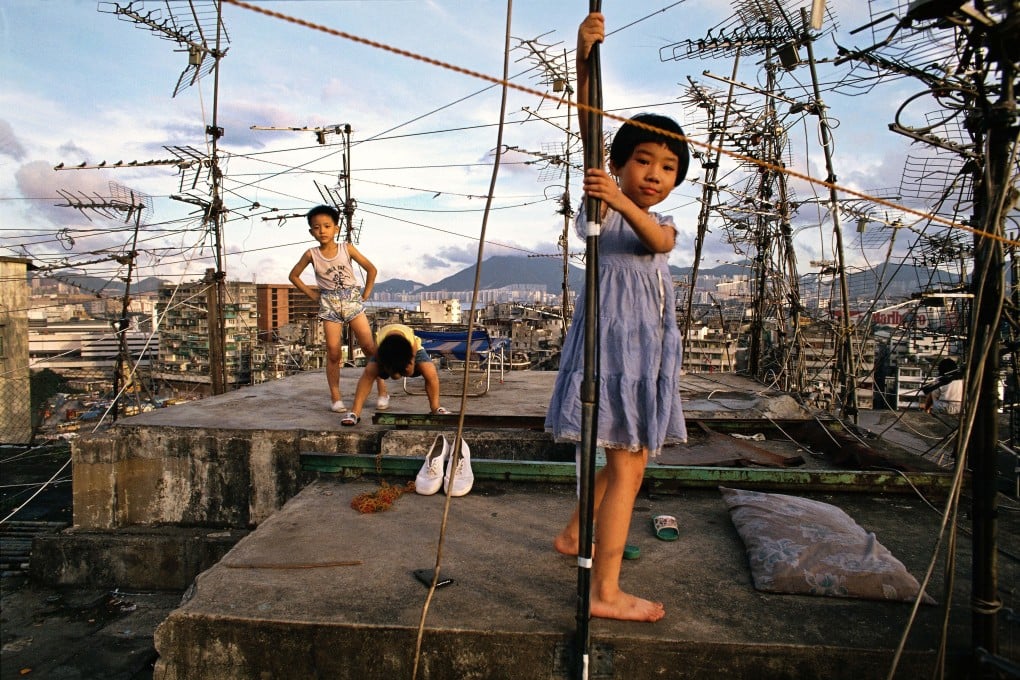 Kowloon Walled City is depicted in stunning fashion by Greg Girard and Ian Lambot in photos including “Children playing on Walled City rooftop (1989)”, above, by Girard. Photo: courtesy of Blue Lotus Gallery