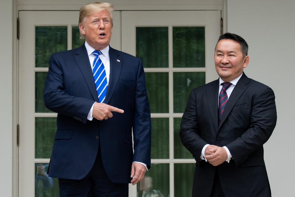 US President Donald Trump speaks with reporters as he welcomes Mongolian President Khaltmaagiin Battulga in the Rose Garden of the White House in Washington on July 31. Photo: AFP
