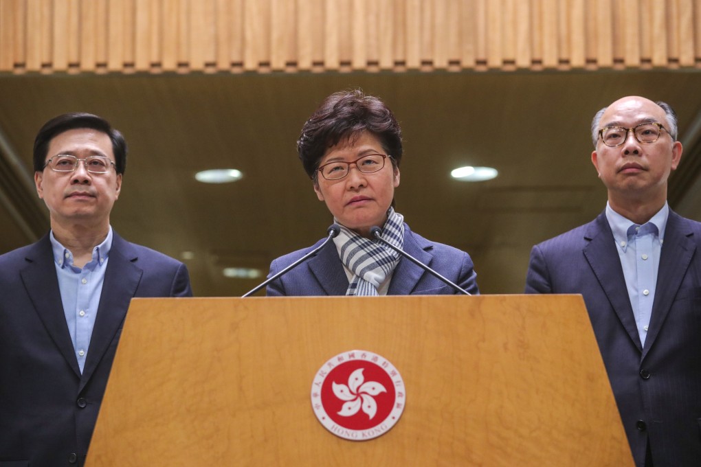Chief Executive Carrie Lam Cheng Yuet-ngor (centre) at a press conference with Secretary for Security John Lee Ka-chiu (left) and Secretary for Transport and Housing Frank Chan Fan on November 11. The government can announce an independent inquiry and restart political reforms. Doing the right thing is not a sign of weakness. Photo: May Tse