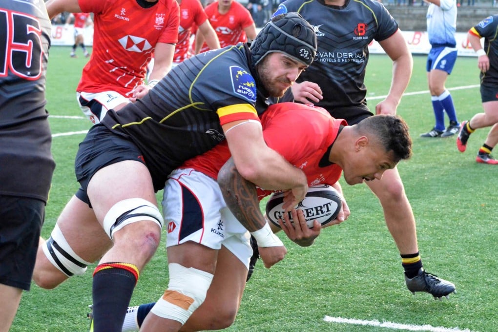 Nate De Thierry holds onto the ball during Hong Kong’s game against Belgium. Thierry got his first cap during the match. Photo: HKRU
