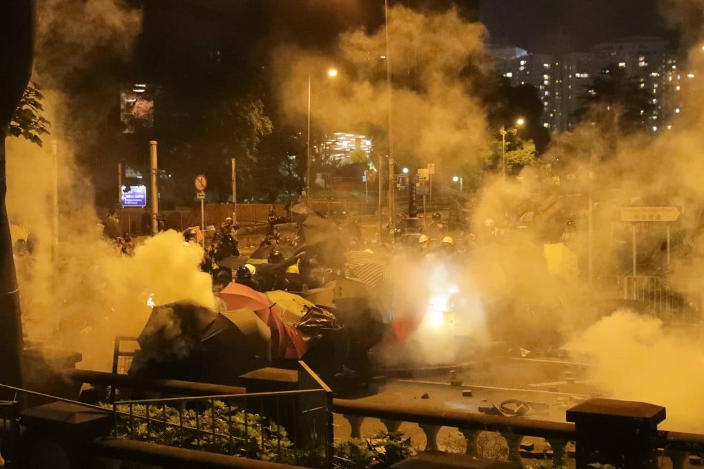 Police fire tear gas at protesters on Science Museum Road outside Polytechnic University in Tsim Sha Tsui. Photo: Edmond So