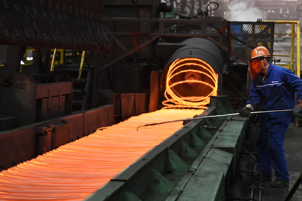 A worker manipulates coils of steel at Xiwang Special Steel in Zouping County in eastern China's Shandong province in May 2018. Photo: Associated Press