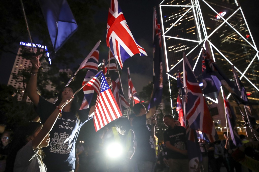 Hong Kong protesters wave the British and US national flags at a rally in Central on August 16. Photo: Winson Wong