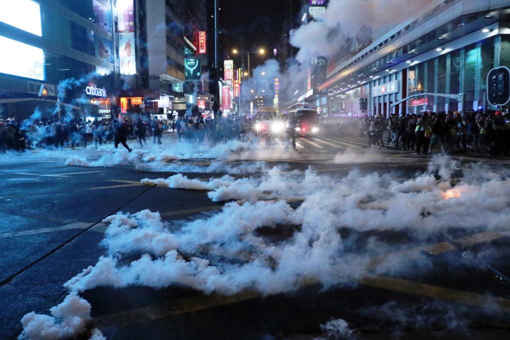 Tear gas fired during clashes between anti-government protesters and anti-riot police at the junction of Nathan Road and Argyle Street in Mong Kok on October 27. Photo: Sam Tsang