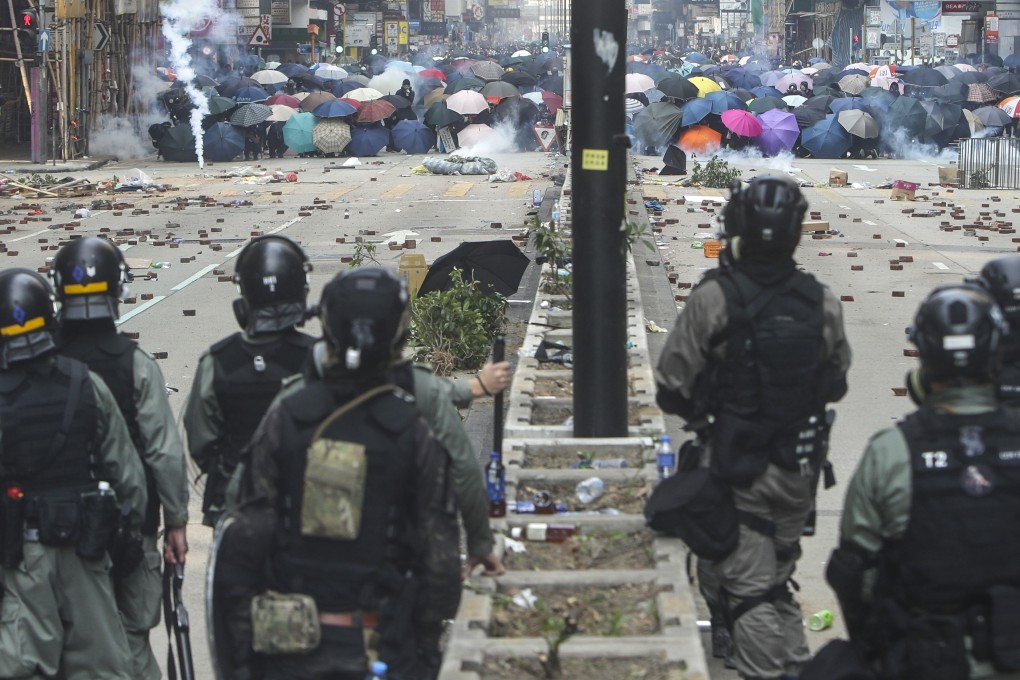 Anti-government radicals and riot police face off on Nathan Road in Tsim Sha Tsui on Monday. Photo: Winson Wong
