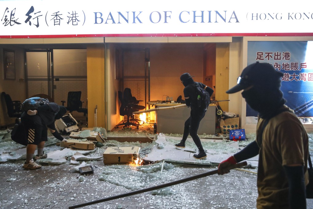 Protesters set a Bank of China branch on fire on Sha Tsui Road in Tsuen Wan on October 4 following a rally against the anti-mask law introduced by the government. Photo: Winson Wong