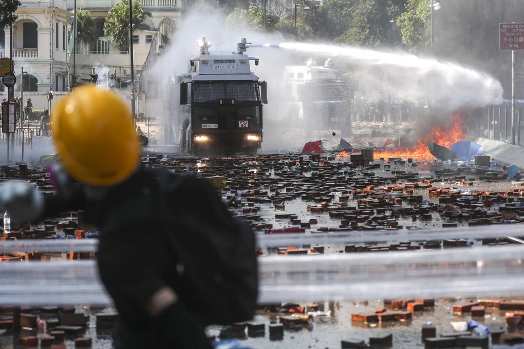 Chaotic exchanges in Hong Kong between police and protesters have added to concerns that Sunday’s elections could be postponed. Photo: Sam Tsang